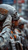 Soldiers in uniform salute during a cold and snowy ceremony in a city square photo