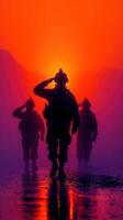 Soldiers saluting at sunset in a misty landscape with vibrant orange and purple hues photo