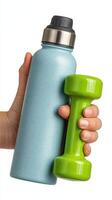 Hand holds blue water bottle and green dumbbell for fitness and hydration routine photo