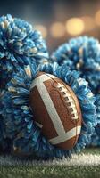 Football surrounded by blue pom poms at a lively sports event in a stadium during an afternoon game photo