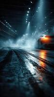 Nighttime drift racing event showcases a sleek car leaving tire marks on a dimly lit track filled with fog photo