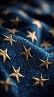 Intricate golden star embroidery on dark blue fabric showcases craftsmanship and design elegance photo