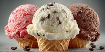 Three vibrant ice cream scoops in waffle cones served on a cool surface photo
