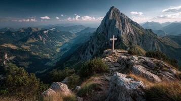 Majestic mountain landscape featuring a cross marking the summit during a serene afternoon in Switzerland photo