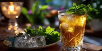 Refreshing herbal drink served with mint leaves and ice near a softly lit background during evening hours photo