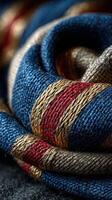 Detailed view of woven fabric with red, blue, and gold threads in a close-up display showcasing intricate patterns and textures photo