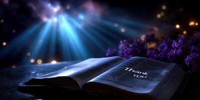 Book open with thank you message illuminated by soft light during the night, creating a serene and peaceful atmosphere photo