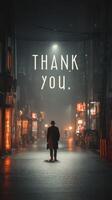 Man walks alone in dimly lit urban street at night with grateful message displayed in the background photo