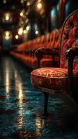 Elegant red chair stands in vintage train interior with warm lighting and polished reflective floor photo