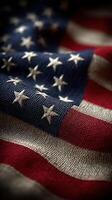 Close-up view of an American flag showcasing its textured fabric and vibrant colors in a warm light photo
