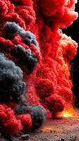 Vivid explosion of red and black smoke creates a dramatic display of nature's power in a dark environment photo