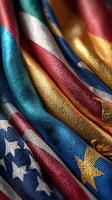 Vibrant textures of multiple flags intertwining on a fabric surface showcasing cultural diversity and unity photo