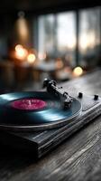 Vintage turntable playing a vinyl record in a cozy dimly lit room during the evening photo