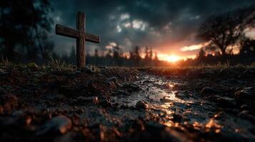 Sunset over a quiet cemetery with a wooden cross in the foreground and clouds illuminated by warm light photo
