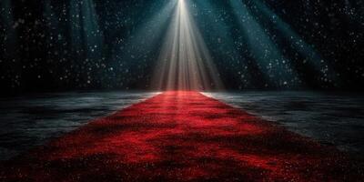 Red carpet with dramatic lighting in a dark venue creates an elegant atmosphere for special events and celebrations photo