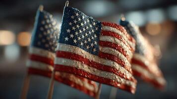 American flags adorned with droplets set against a blurred background showcasing a patriotic atmosphere during a celebration photo
