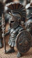 Detailed bronze miniature of a Spartan warrior standing with shield and spear during historical reenactment preparations photo