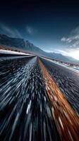 Majestic winding road through mountainous terrain under a clear blue sky at dusk photo