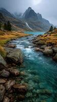 Serene river flowing through rocky landscape under cloudy skies in a mountainous region photo