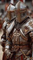 Knights in shining armor preparing for a medieval festival in a historical reenactment event photo