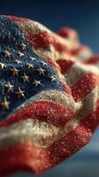 Waving American flag displaying vibrant colors and stars in a clear blue sky photo