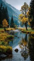 Beautiful autumn landscape with a serene river and mountains near a peaceful village in the morning light photo