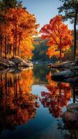 Vibrant autumn colors reflected in a serene river surrounded by trees in a peaceful natural setting photo