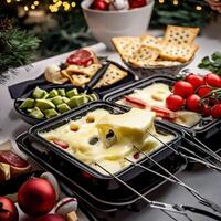 A table with cheese, crackers, and other food photo