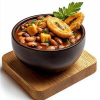A bowl of beans and a piece of bread photo
