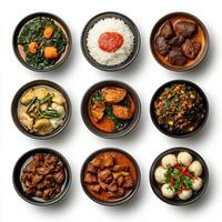 A collection of different types of food in black bowls photo