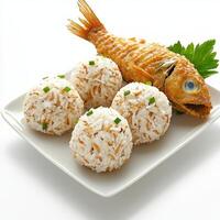 A plate of rice and fish with a green leaf photo