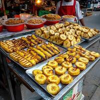 A man is standing in front of a food stand photo