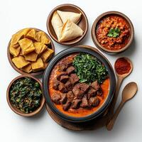A variety of dishes including meat, vegetables and bread photo