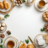 Easter breakfast with croissants, coffee, tea, biscuits, eggs, bread, and photo