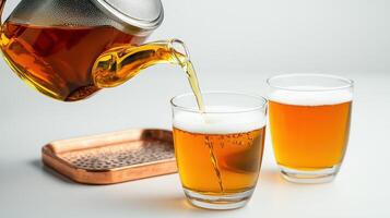 Beer pouring into two glasses on a tray photo