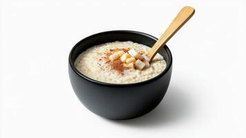 A bowl of oatmeal with a spoon in it photo