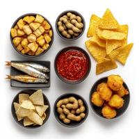 A variety of snacks and chips in bowls photo