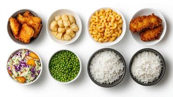 A variety of different foods including rice, peas, and chicken photo