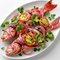 Grilled red snapper with peppers and onions photo