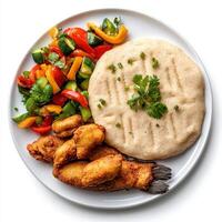 A plate of food with a white plate on a table photo