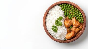 Chicken curry with rice and peas on white background photo