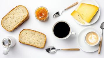 A white table with bread, cheese, coffee and a spoon photo