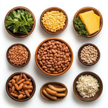 Various types of beans and nuts in bowls photo