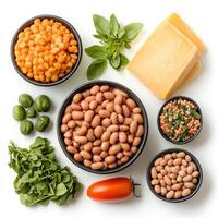 Various types of beans, cheese, and vegetables photo