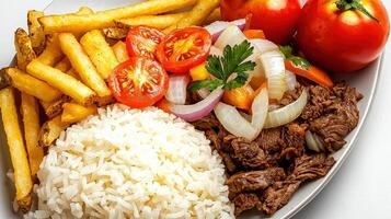 A plate of food with rice, meat, vegetables and french fries photo