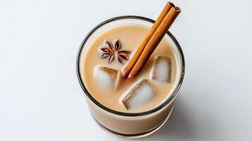An iced coffee with cinnamon sticks and ice photo