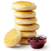 A stack of pancakes with jam on top photo