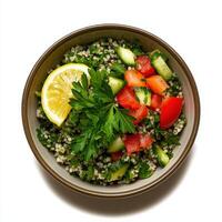Couscous salad with lemon and parsley, isolated on white background photo