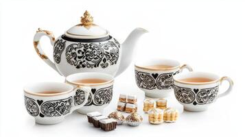 A black and white tea set with gold accents photo