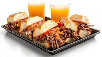 A tray with four sandwiches and two glasses of orange juice photo